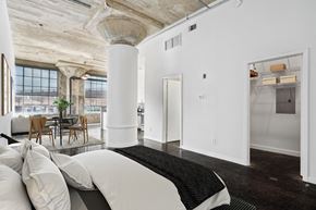 Dallas apartment for rent - Adam Hats Lofts staged studio bedroom. Apartments in Dallas, TX.
