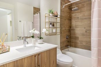 Designer tiled bathrooms with contemporary finishes and fixtures