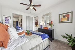 Houston apartment for rent - Cozy bedroom with a ceiling fan and contemporary decor at Allusion at West University apartments in Houston, TX