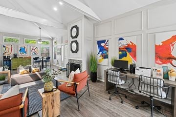 Lewisville apartment for rent - A modern living room with a fireplace and a painting on the wall.