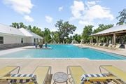 Tallahassee apartment for rent - Sparkling swimming pool with lounge chairs at Capital Grand Apartments in Tallahassee, FL