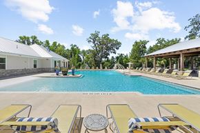 Tallahassee apartment for rent - Sparkling swimming pool with lounge chairs at Capital Grand Apartments in Tallahassee, FL