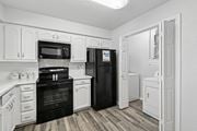 Plano apartment for rent - Model unit kitchen at Chisholm Place in Plano, TX