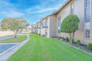 Shreveport apartment for rent - Apartment buildings with second-floor balconies and green grass outside   at The Creole Apartments in Shreveport, LA