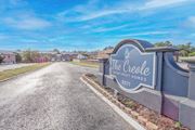 Shreveport apartment for rent - A stone sign for "The Creole Apartment Homes" is at the entrance to The Creole Apartments in Shreveport, LA