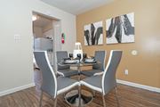 Bossier City apartment for rent - A dining room with a table set for four at The Drake in Bossier City, LA