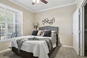 Richardson apartment for rent - Windsor bedroom with carpet, a window, and a ceiling fan at Encore at Buckingham Apartments in Richardson, TX
