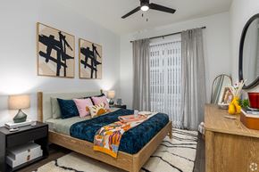 Denton apartment for rent - Model apartment spacious bedroom with ceiling fan at Era apartments in Denton, TX