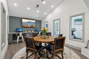 Duluth apartment for rent - A business center with a wooden table and chairs and computers at Gwinnett Square Apartments in Duluth, GA