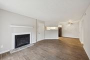 Duluth apartment for rent - A living room with a fireplace and wood flooring at Gwinnett Square Apartments in Duluth, GA