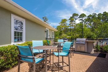 Outdoor grill island by pool