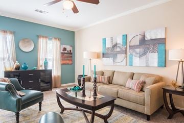 Shreveport triplex for rent - a living room with a couch and a table