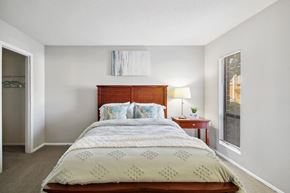 Charlotte apartment for rent - a bedroom with a bed and a window at Johnston Creek Crossing in Charlotte, NC