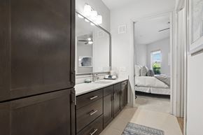 Dallas apartment for rent - A bathroom with a large mirror and ample cabinet space at Knox Heights in Dallas, TX