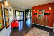 Austin apartment for rent - Interior of leasing office with red couch at Westdale Parke Apartments in Austin, Texas, TX