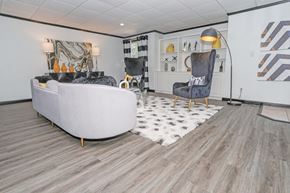 Shreveport apartment for rent - Clubhouse lounge area with large couch at Maplewood apartments in Shreveport, LA.