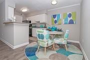 Shreveport apartment for rent - A cypress dining room with a table and chairs in the middle of the room at The Marq in Shreveport, LA