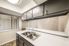 Dallas apartment for rent - the kitchen of our studio apartment atrium with sink and window