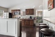 Dallas apartment for rent - a kitchen with a counter and stools in it