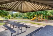 Dallas apartment for rent - a picnic pavilion with picnic tables and a playground
