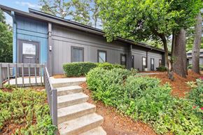 Smyrna apartment for rent - Attractive and well-maintained exterior of apartment building at Pine Village North in Smyrna, GA