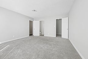 Roswell apartment for rent - Our spacious master bedroom with carpeted floor and en suite bathroom in C2b floor plan at Riverwood Crossing apartments in Roswell, GA.