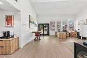 Wylie apartment for rent - A living room with a wooden floor and a television.