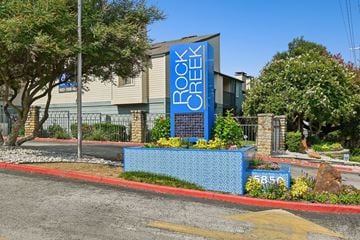 Dallas apartment for rent - A building with a blue sign that says "Rock Creek".
