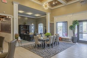Titusville apartment for rent - a dining room with a table and chairs in front of a window