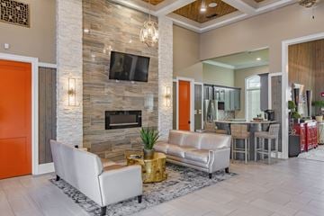 Titusville apartment for rent - a living room with a fireplace and a television