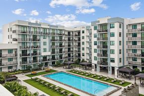 West Miami apartment for rent - Pool area with apartment balconies overlooking the pool at Twenty2 West luxury apartments in Miami, FL