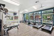 Olympia apartment for rent - A gym with treadmills, weights, and exercise equipment at The Madison apartments in Olympia, WA