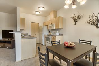 Cabinetry kitchen with dining area