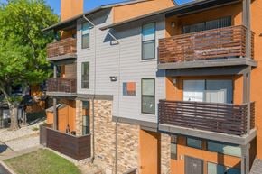 Arlington apartment for rent - A modern apartment building with balconies at Vine Apartments in Arlington, TX