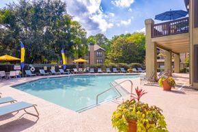 Atlanta apartment for rent - a swimming pool with lounge chairs and umbrellas at homewood suites by hilton