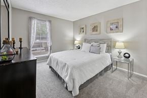 Austin apartment for rent - B1 second bedroom with white bed at Westdale Pointe in Austin, TX