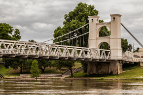 Euless apartment for rent - A white bridge with a metal railing crosses over a body of water.