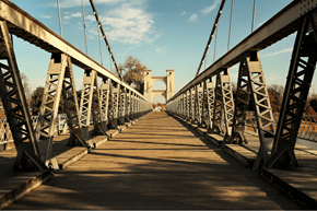 Euless apartment for rent - A long metal bridge with a wooden walkway.