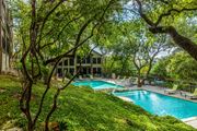 Austin apartment for rent - a swimming pool with a house in the background
