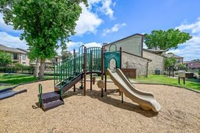 Houston apartment for rent - Our fun playground with a slide at Bear Creek Crossing in Houston, TX