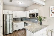 Austin apartment for rent - Leasing office kitchen with fridge and microwave at Hunters Chase in Austin, TX