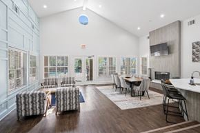 Plano apartment for rent - Modern clubhouse with comfortable seating and a TV at La Costa Apartments in Plano, TX