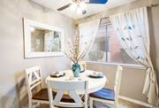 Austin apartment for rent - a dining room with a table and chairs and a window