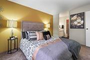 Houston apartment for rent - a bedroom with a bed and two lamps