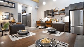 Buffalo apartment for rent - A modern kitchen with a dining table set for two.