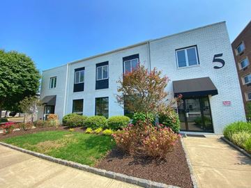 Norwalk apartment for rent - A building with the number 5 on it has a small tree in front of it.