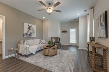 Smyrna townhouse for rent - A living room with a white couch and a painting of a horse on the wall.