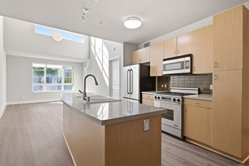 Los Angeles apartment for rent - A modern kitchen with wooden cabinets and stainless steel appliances.