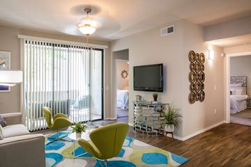 Phoenix apartment for rent - a living room with a tv and a sliding glass door