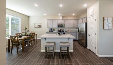 Mesa apartment for rent - a kitchen with a marble counter top and a dining table
